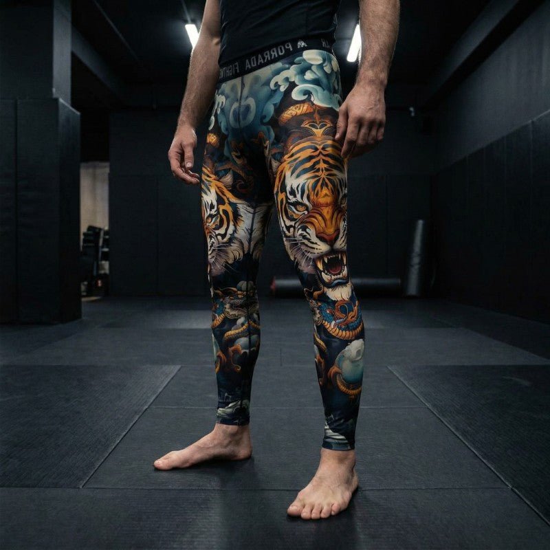 Male athlete wearing Porrada Fightwear men’s BJJ spats with tiger design while training in a MMA gym.