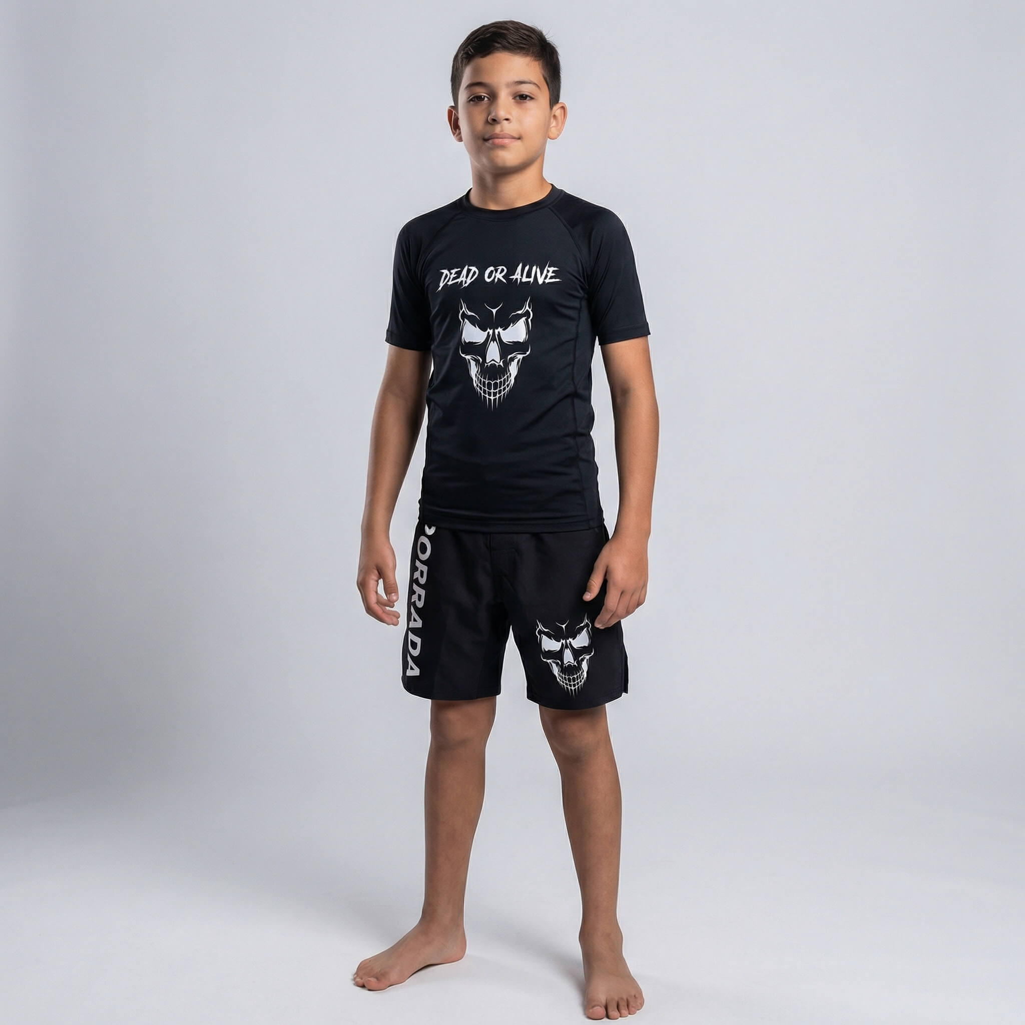 Kids’ black rash guard with short sleeves, featuring a skull design for martial arts and grappling