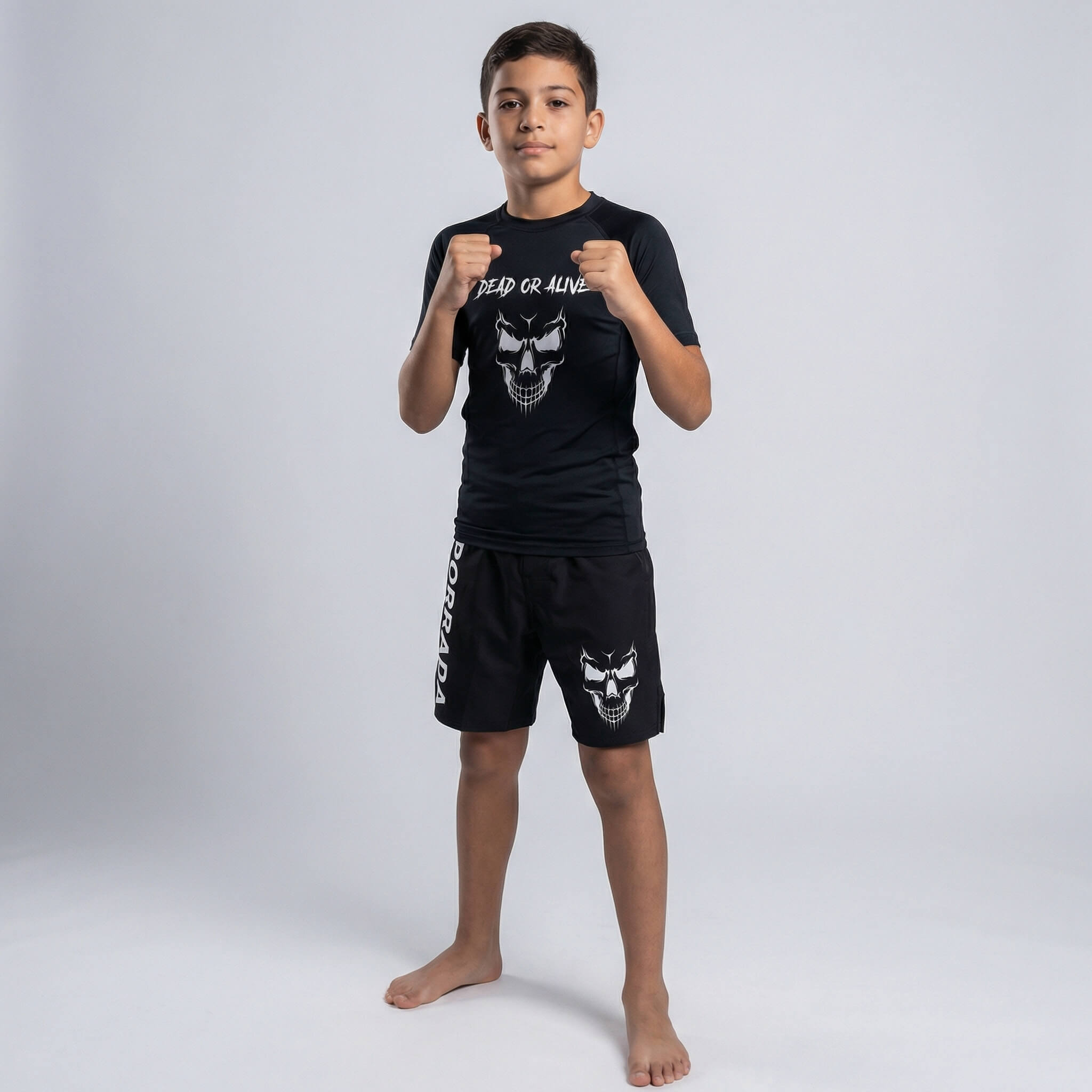 Children’s short-sleeve black rash guard with ‘Dead or Alive’ skull graphic, perfect for grappling and MMA
