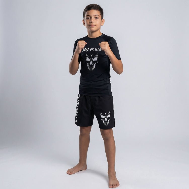 Kids' martial arts fight shorts in black, featuring a ‘Dead or Alive’ skull design for training and competition