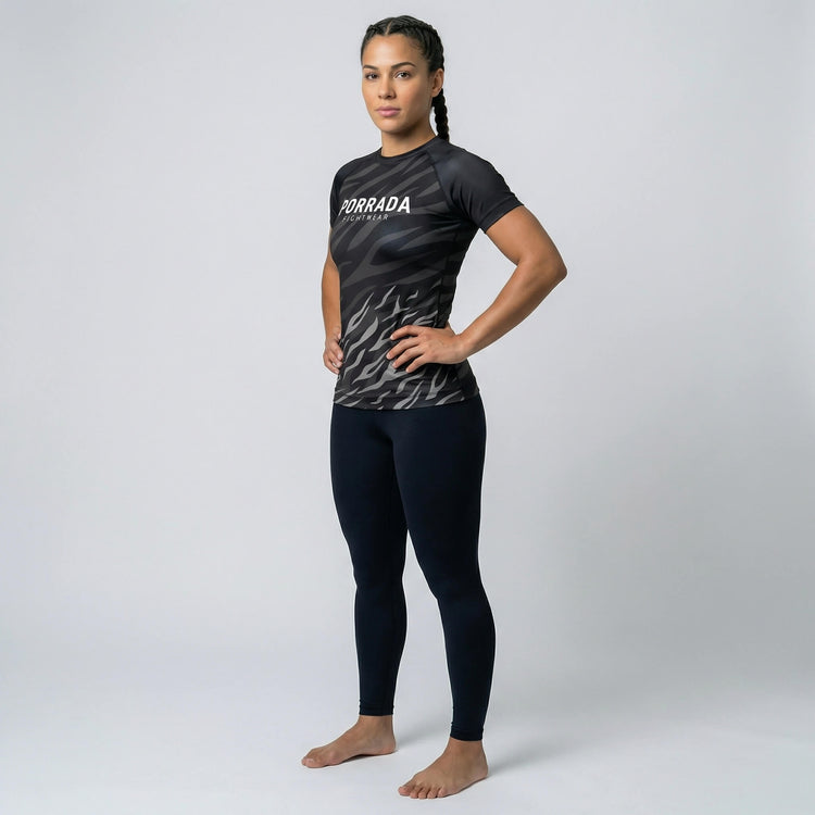 Performance women’s short-sleeve rash guard with Black Belt competition ranking 