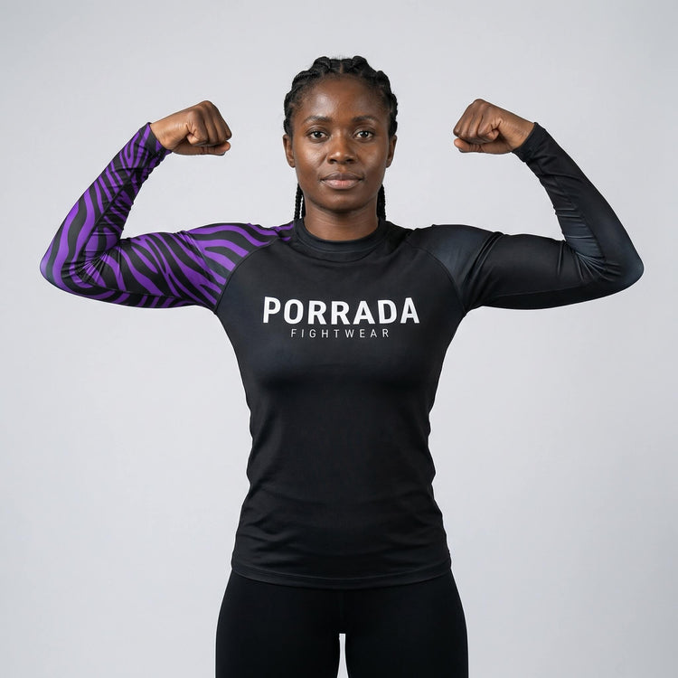 Female athlete’s IBJJF purple-ranked rash guard for BJJ and MMA