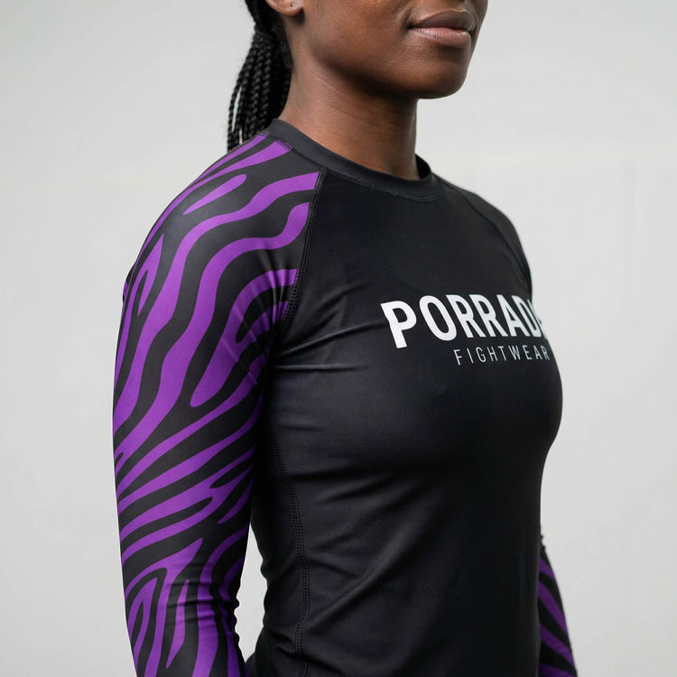 Close view of women's IBJJF‑legal purple ranked rash guard